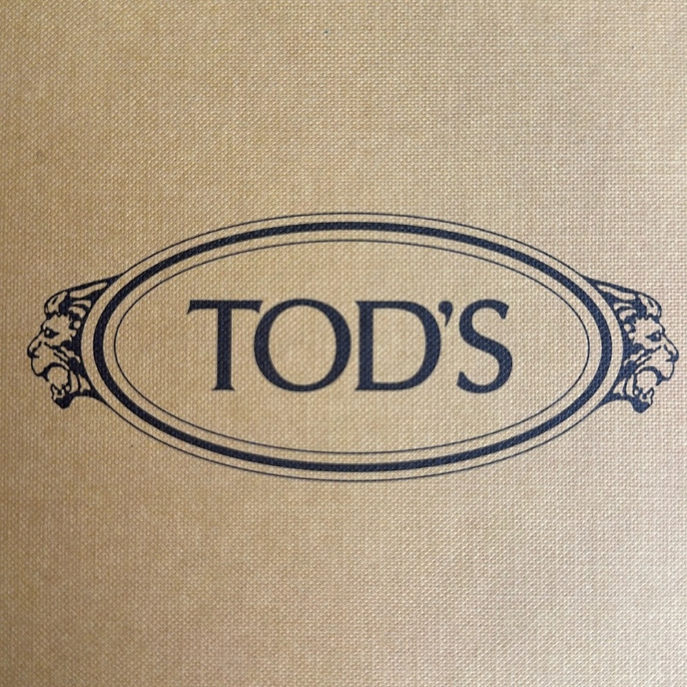 Tods. Like new!!! tennis shoe, worn once. Pink, blue, gray
